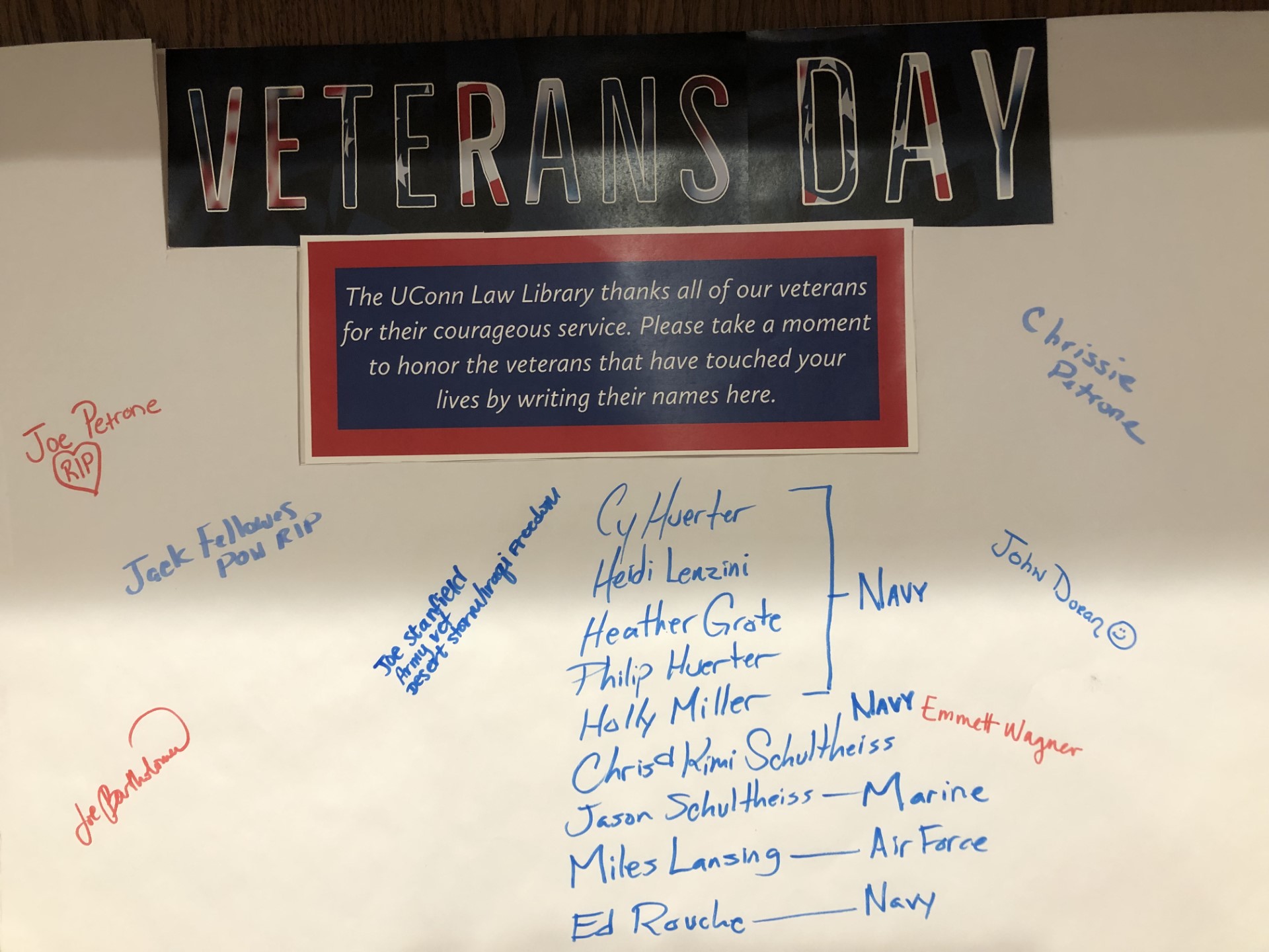 Display honoring Veterans Day with names of individuals written 